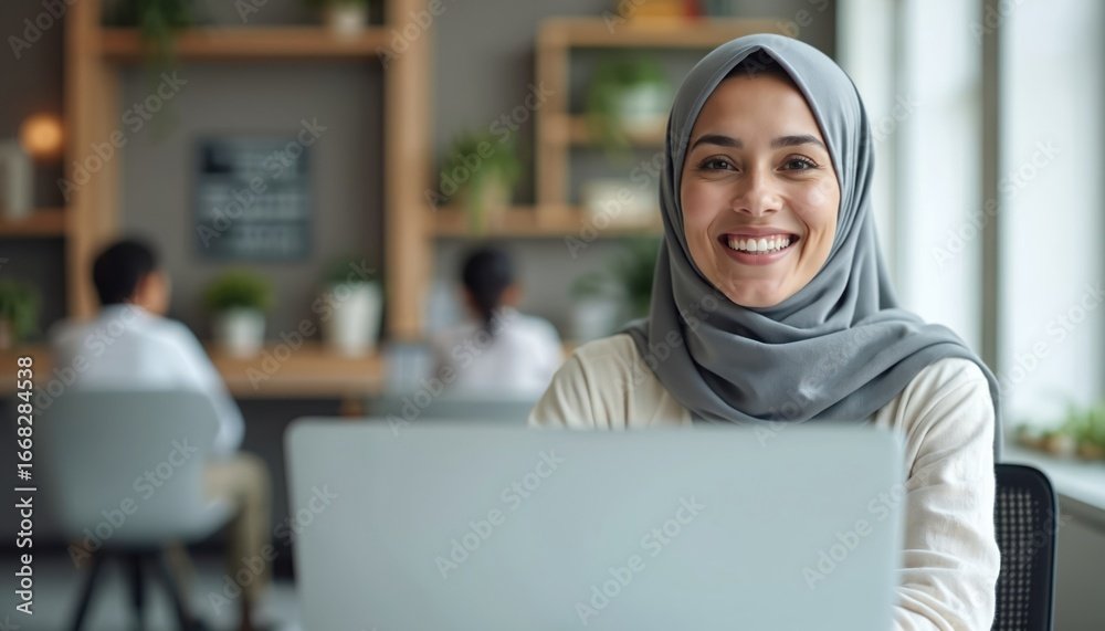 Smiling Arabic teacher in hijab leads online class. Engaged multicultural students learn via e-learning platform. Modern education focused on pedagogy, diverse cultures promotes global knowledge